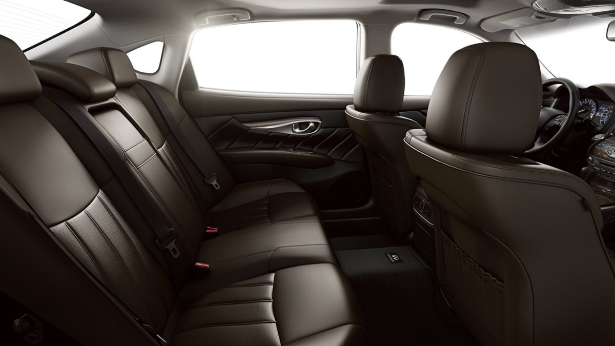 Interior Side View Of The 2019 INFINITI Q70L Sedan&#39;s Spacious Interior And Rear Seats In Java Leather